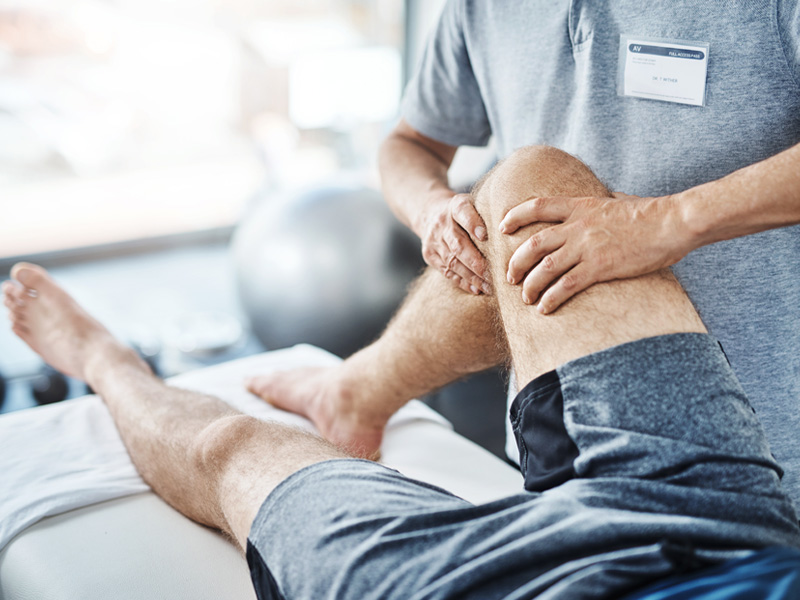 Patient getting knee adjusted